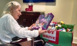 Ms. Smirtic donates to to MUST Ministries toy drive