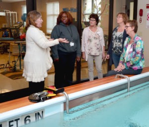 Pictured left to right: Tammy Luther-Chalker, A.G. Rhodes Director of Rehabilitation and Therapy Services and Paige Barlow, Physical Therapy Assistant, show the therapy pool to visitors from the Netherlands: Grada Lenderink, RN; Ellie Jetten, MD; and Kitty te Moller, PT.